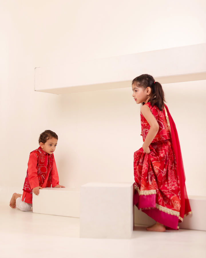 Girls Red Bandhani Print Lehenga Choli Set (Set of 3) + Boys Red Bandhani Festive Kurta Jacket Set (Set of 3)