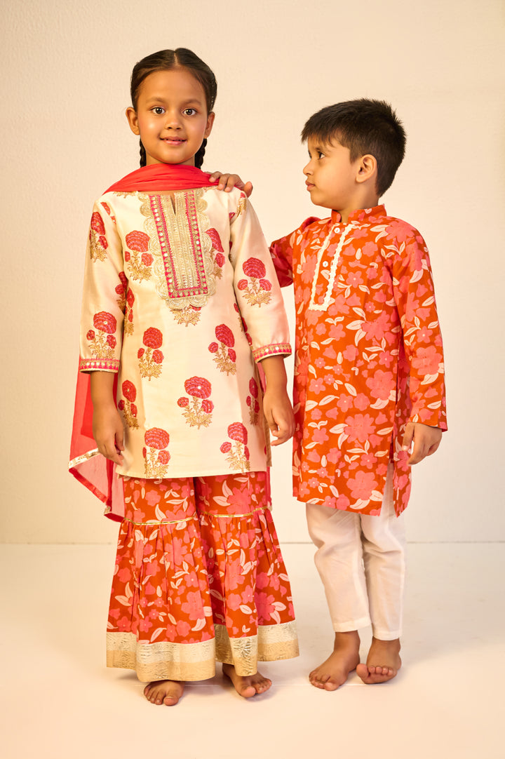 BOYS ORANGE FLORAL MODAL KURTA WITH PAJAMA (SET OF 3) + GIRLS ORANGE FLORAL HANDBLOCK CHANDERI KURTI WITH MODAL SHARARA AND DUPATTA (SET OF 3)