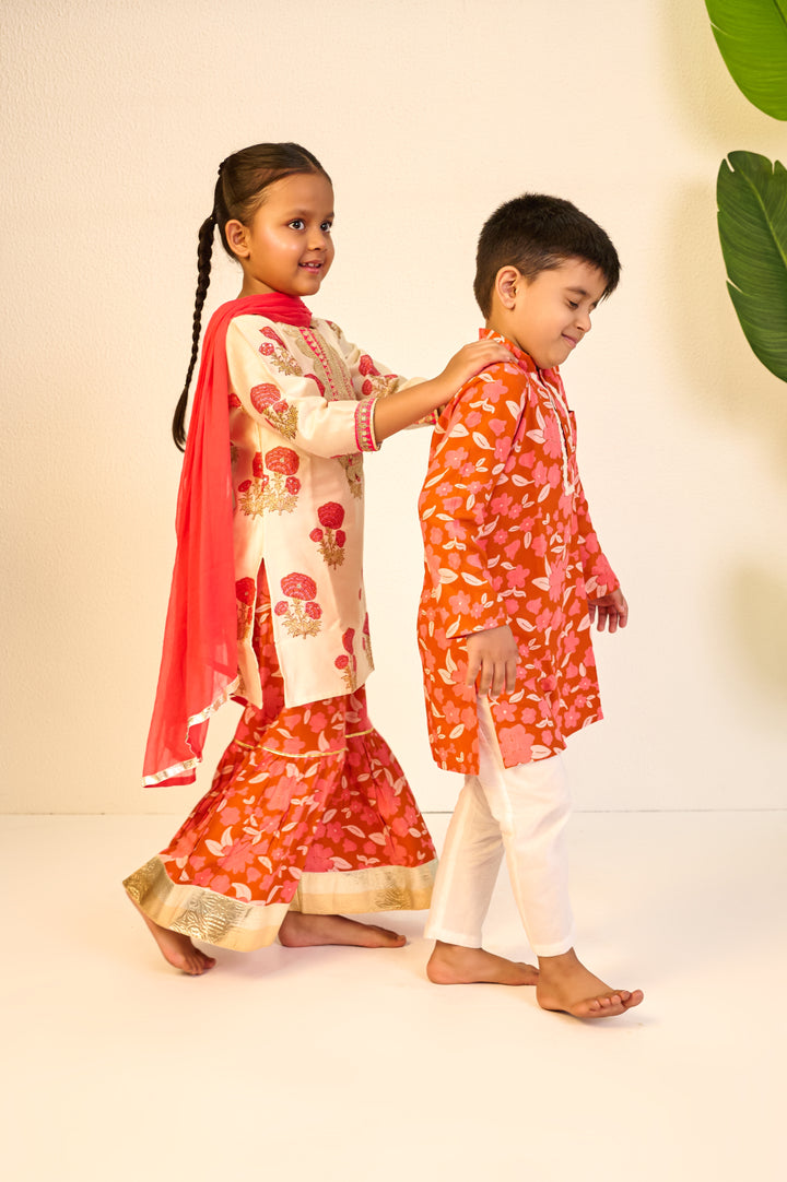BOYS ORANGE FLORAL MODAL KURTA WITH PAJAMA (SET OF 3) + GIRLS ORANGE FLORAL HANDBLOCK CHANDERI KURTI WITH MODAL SHARARA AND DUPATTA (SET OF 3)