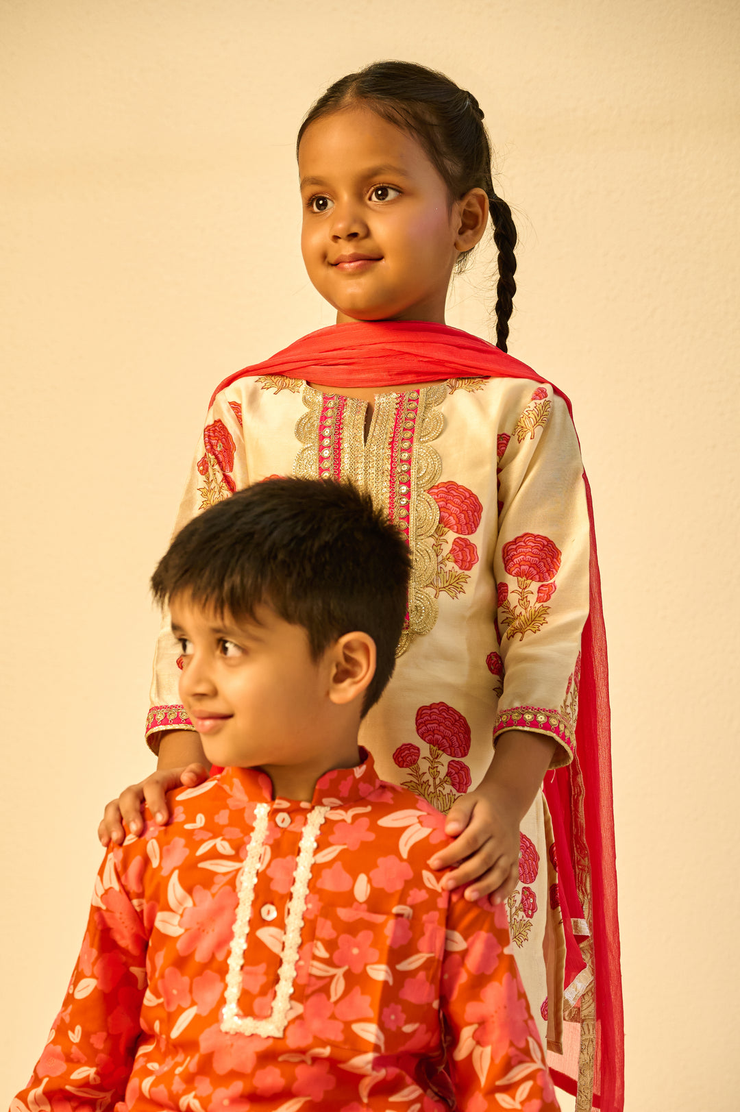 BOYS ORANGE FLORAL MODAL KURTA WITH PAJAMA (SET OF 3) + GIRLS ORANGE FLORAL HANDBLOCK CHANDERI KURTI WITH MODAL SHARARA AND DUPATTA (SET OF 3)