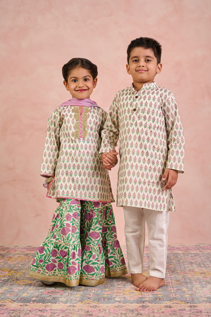 BOYS WHITE GOLD KURTA WITH PAJAMA (SET OF 2) + GIRLS OFF WHITE KURTI WITH PURPLE JAAL SHARARA AND DUPATTA (SET OF 3)