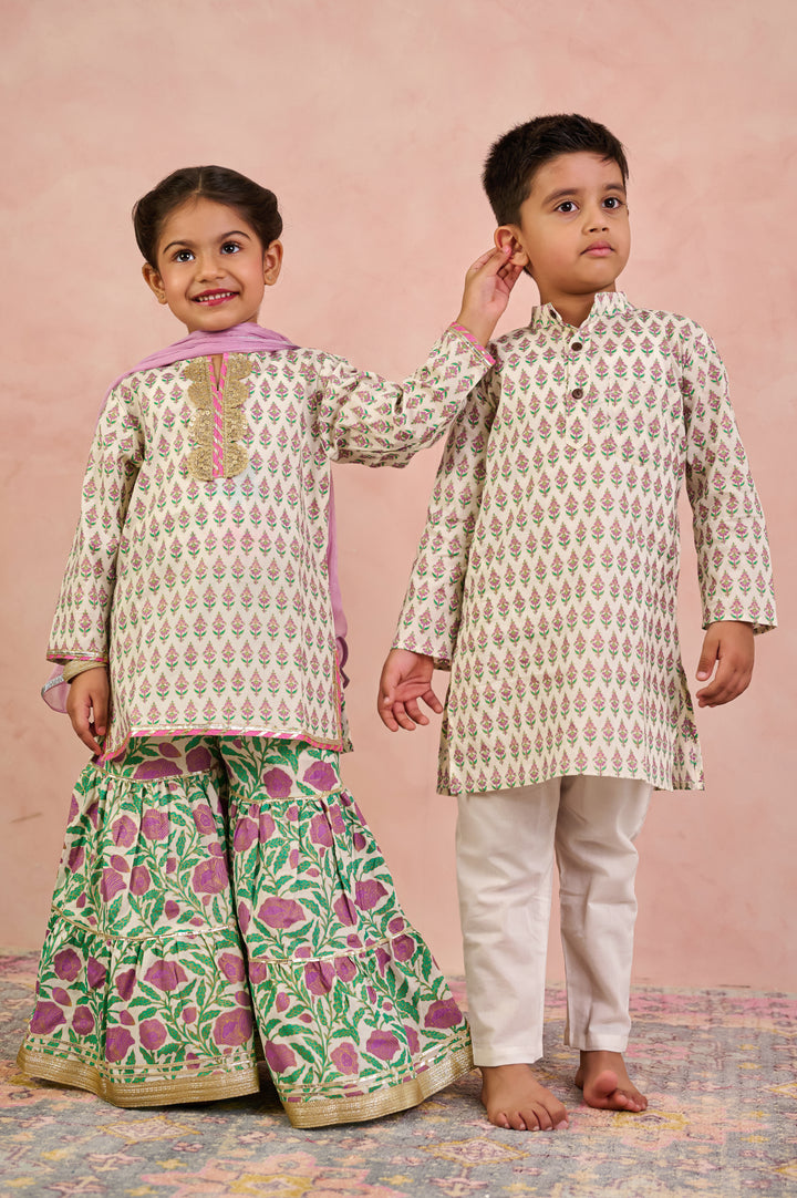 BOYS WHITE GOLD KURTA WITH PAJAMA (SET OF 2) + GIRLS OFF WHITE KURTI WITH PURPLE JAAL SHARARA AND DUPATTA (SET OF 3)