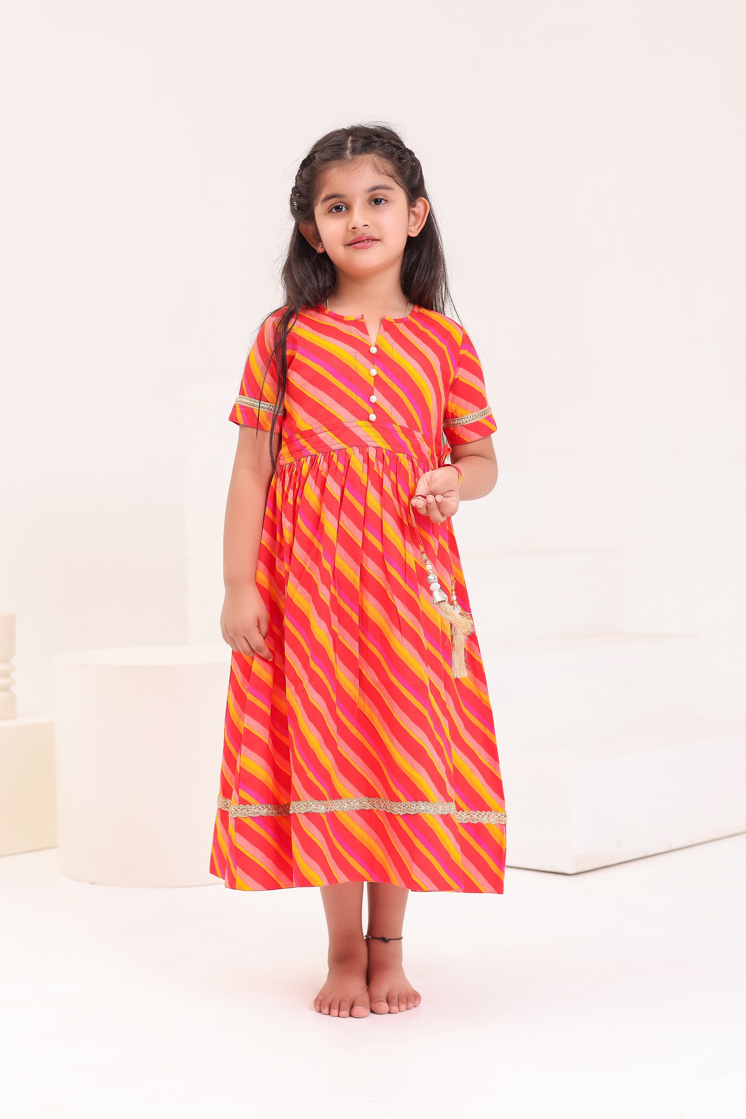 GIRLS RED PINK LEHERIYA ANKLE LENGTH ETHNIC GOTA DRESS WITH TASSELS
