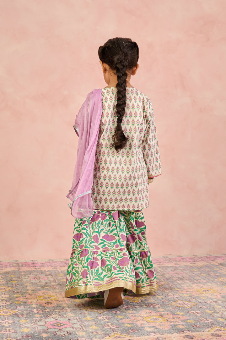 GIRLS OFF WHITE KURTI WITH PURPLE JAAL SHARARA AND DUPATTA (SET OF 3)