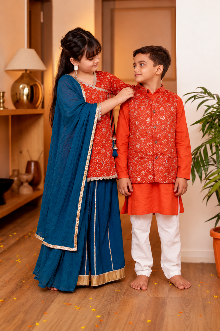Girls Muslin Rust Orange Bandhani Angrakha Kurti & Blue Skirt with Dupatta (Set of 3) + Boys Rust Orange Bandhani Printed Jacket with Kurta & Pyjama 3-Piece Set