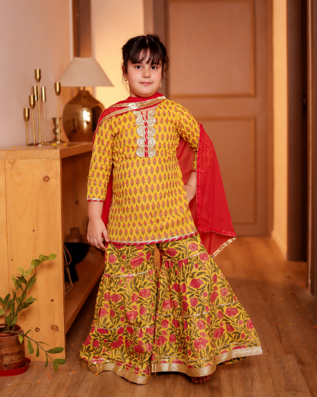 Girls Bright Yellow Floral Printed Kurti & Tiered Sharara with Red Dupatta (Set of 3)