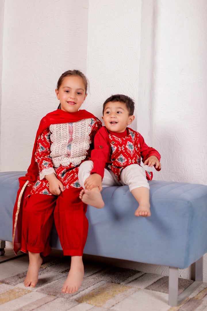 BOYS RED IKAT SIDE BUTTON KURTA WITH PAJAMA (SET OF 2) + GIRLS RED IKAT CROCIA YOKE KURTI WITH SALWAR AND DUPATTA (SET OF 3)