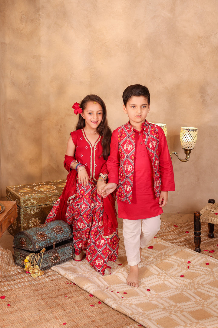 BOYS MAROON PATOLA PRINT JACKET WITH MAROON KURTA AND PAJAMA (SET OF 3) + GIRLS MAROON PATOLA PRINT LEHENGA WITH SLEEVELESS TOP AND DUPATTA (SET OF 3)