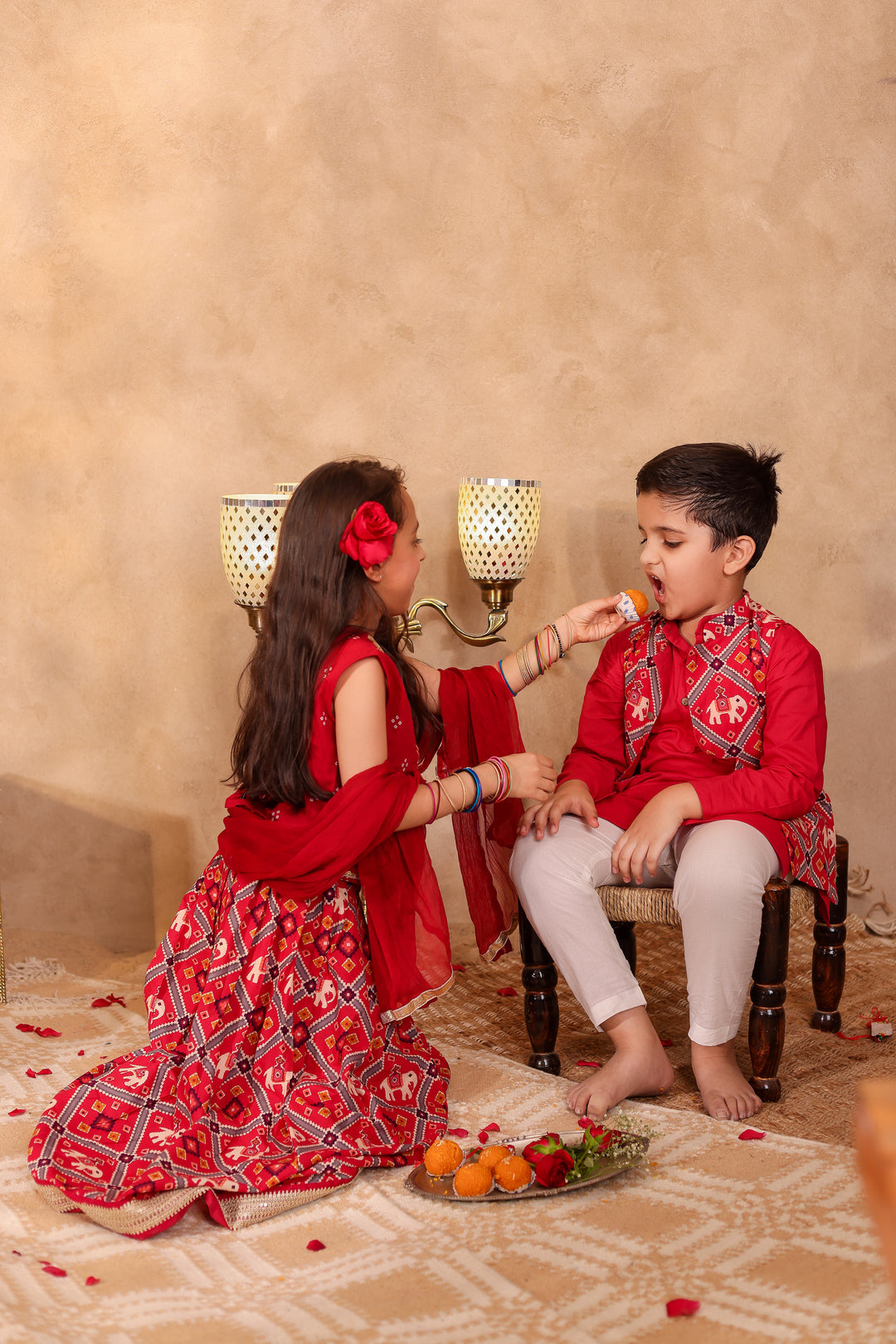 BOYS MAROON PATOLA PRINT JACKET WITH MAROON KURTA AND PAJAMA (SET OF 3) + GIRLS MAROON PATOLA PRINT LEHENGA WITH SLEEVELESS TOP AND DUPATTA (SET OF 3)