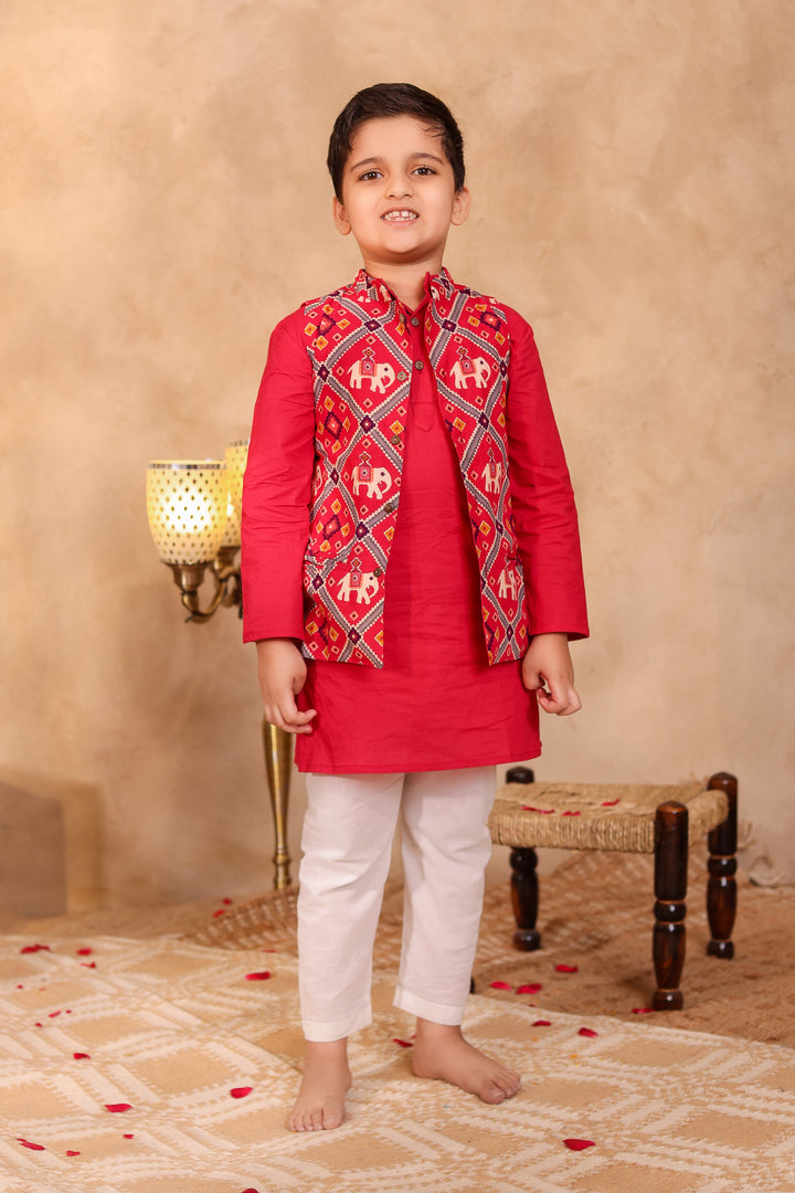 BOYS MAROON PATOLA PRINT JACKET WITH MAROON KURTA AND PAJAMA (SET OF 3) + GIRLS MAROON PATOLA PRINT LEHENGA WITH SLEEVELESS TOP AND DUPATTA (SET OF 3)