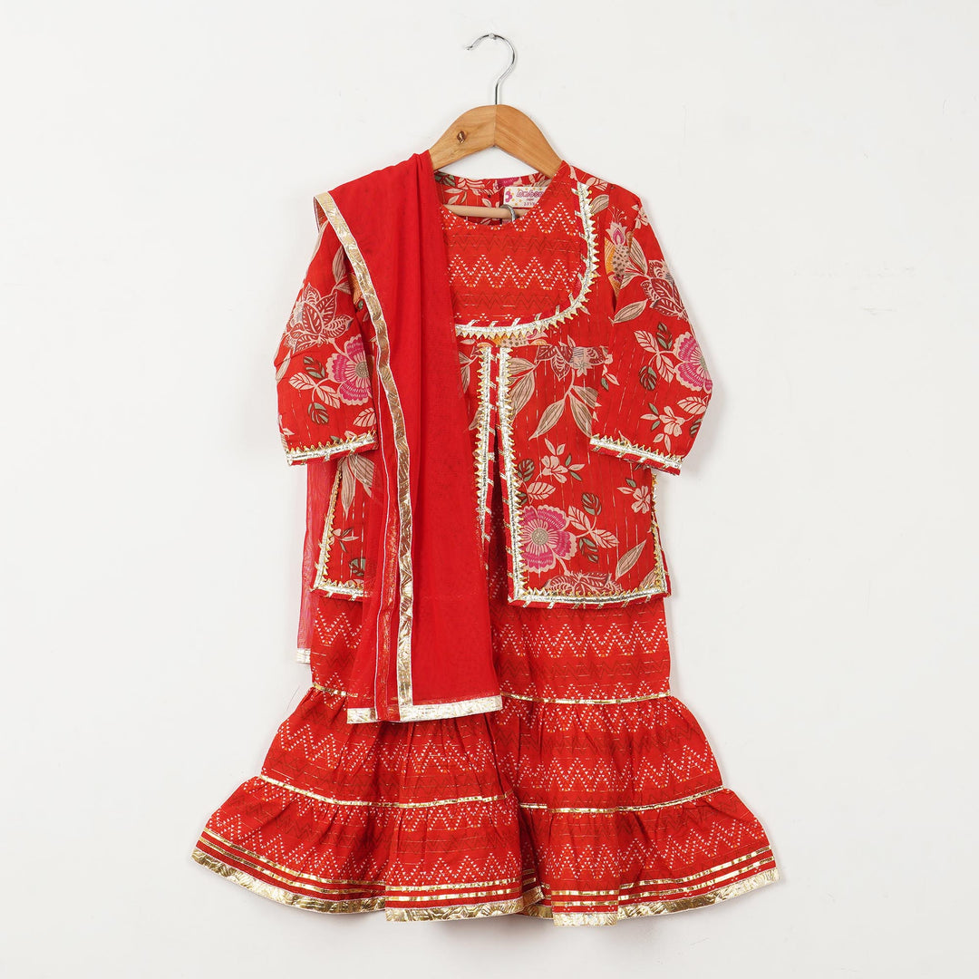 BOYS RED KURTA WITH RED FLORAL JACKET AND OFF WHITE PAJAMA (SET OF 3) + GIRLS RED FLORAL YOKE KURTI WITH LEHERIYA SHARARA AND DUPATTA (SET OF 3) (TWINNING) - Amber Jaipur - Designer Clothes Online India